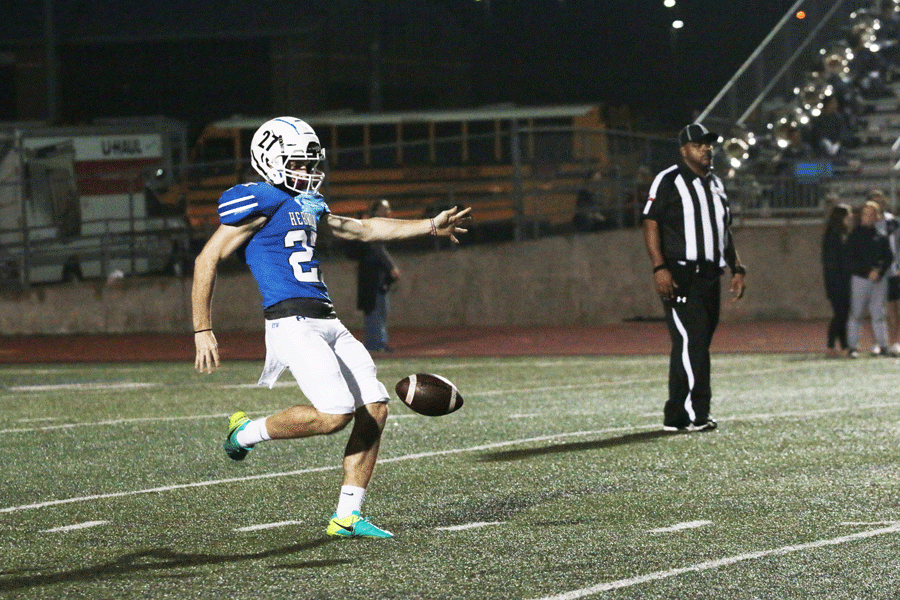 Senior kicker Grant Paulette punts the ball away to Marcus. 