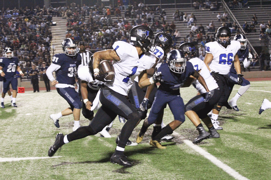 Senior wide receiver Trejan Bridges runs the ball up the field and scores a touchdown. 