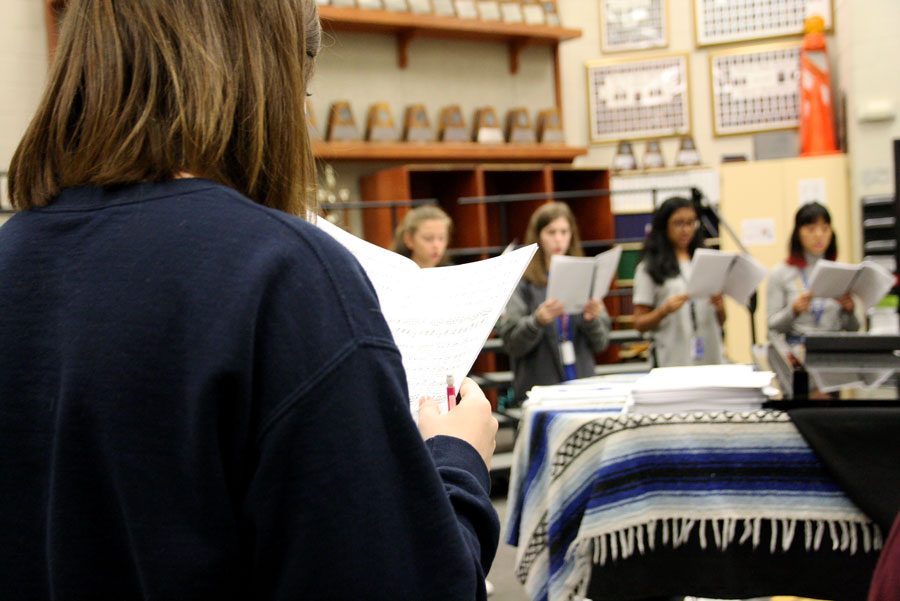 Soprano 1 Caitlin Kresta practices with her sectional during block lunch in the choir room before All State Pre-area.