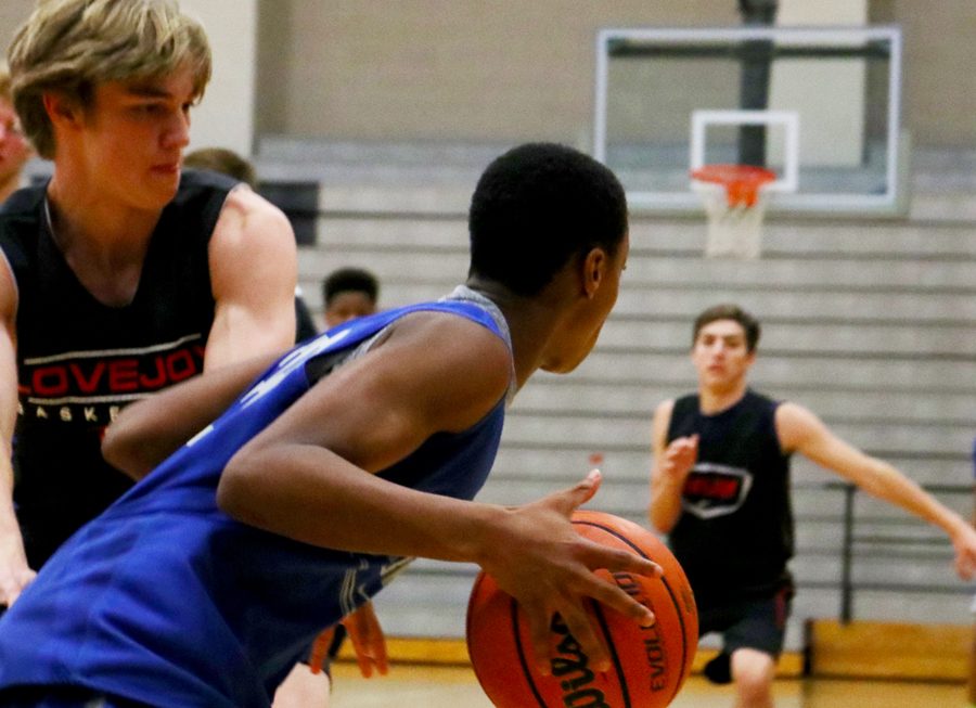 Sophomore David Deal tries to get past Lovejoys defense. JV played a scrimmage game on Nov 6 at Hebron. 