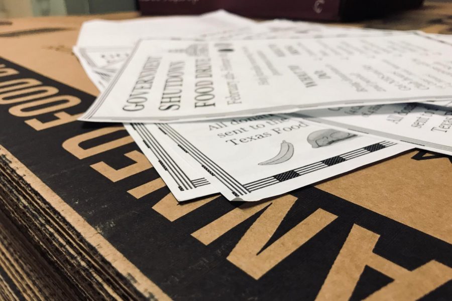 A collection of flyers and North Texas Food Bank provided cardboard boxes. 