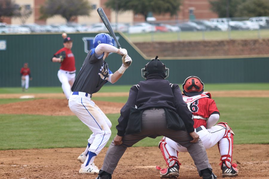 Senior Drake Boggan readies himself for the pitch. Hebron was playing against Arlington Martin on Feb 21. 