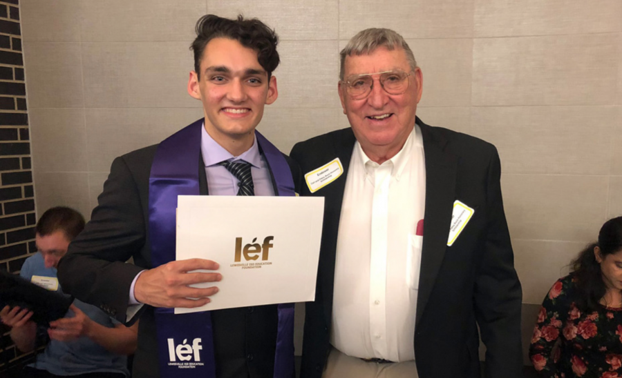 Senior Lucas Gates poses with Carl Buck at the LEF ceremony.