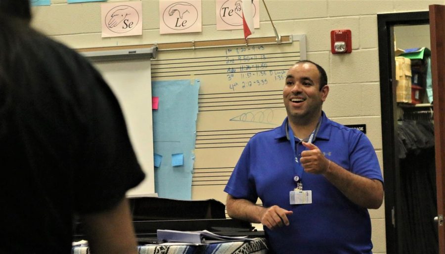 Choir director Alexander Carr teaches the soprano girls choir group during his second day at Hebron. Carr has already made a comfortable environment and connections with his students. “I’ve only met a handful of them, but I’m interested in finding out more about them,” Carr said. 
