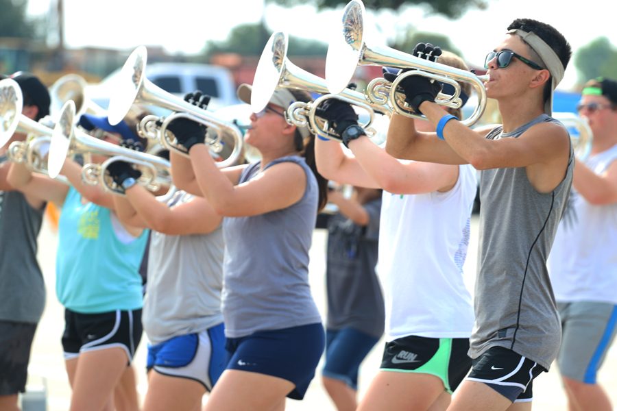Senior Rhett Reasonover plays warm-ups with the rest of the mellophone section. He hopes to have a great last year with the band. “I’m looking forward to getting this last year with all my senior friends before we all go to different colleges,” Reasonover said. “And getting the most out of my last year in this band.”