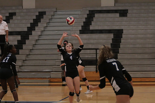 Sophomore Alexandra Geer passes the ball to her teammate. This is Greer’s second year playing on the JV team.