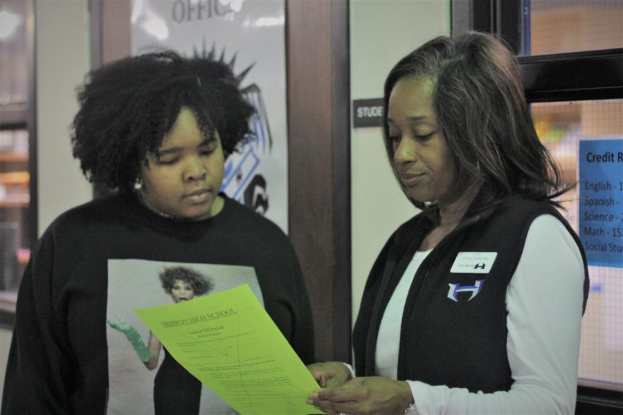 Counselor Marlene Hood assists a student with her schedule before 1st period starts.  The counseling department is hosting a workshop to fill out the FAFSA on Monday. 