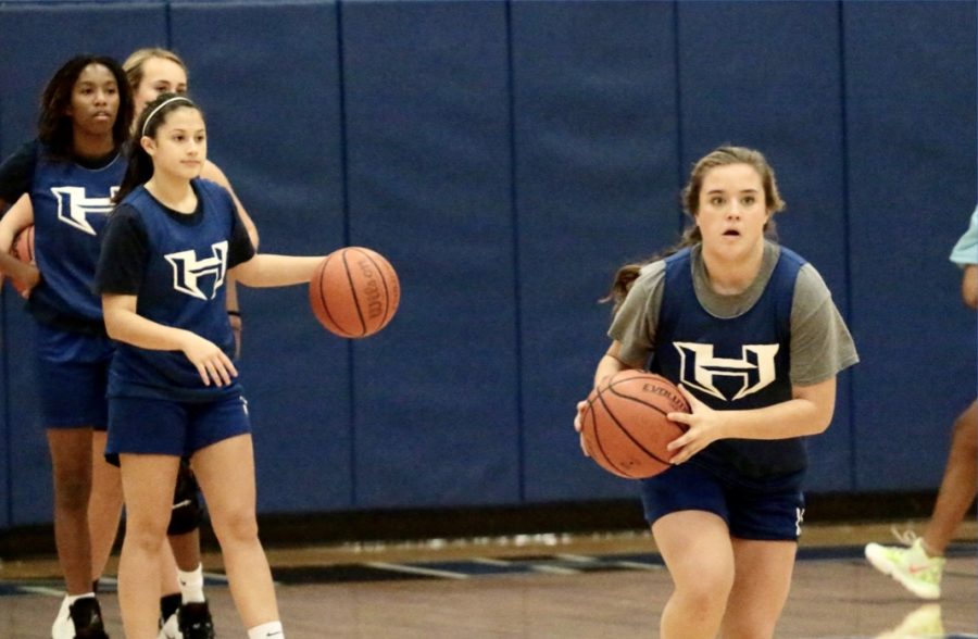 Sophomore Emily Batchelor runs toward the basket during practice. The Allen tournament is the second tournament the girls will play in this year’s season.
