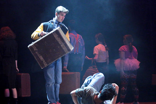 The cast performs a hectic train station scene. Sophomore Braxton Dietz plays Cedric and Sophomore Ali Niaz plays Wayne.
