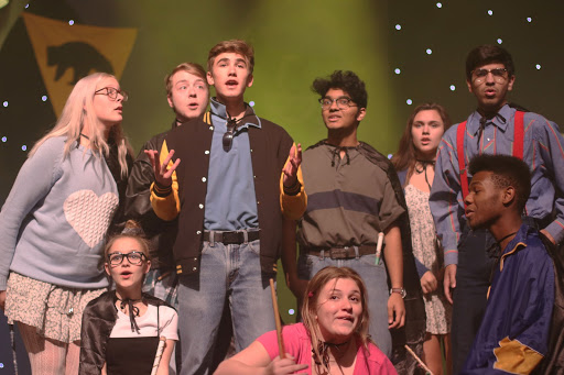 The Puffs gathers around Cedric as he tells them about the house cup. The Puffs have always gotten fourth in the competition, so they make it their goal to be “third or nothing.”