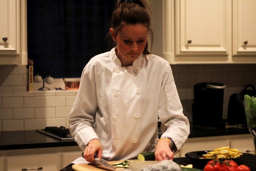  Junior Tara O’Donnell cooks ratatouille, a stewed vegetable dish, in her kitchen. She wears the chef’s coat that she won while on Chopped Junior. “I love to cook different dishes,” O’Donnell said. “My favorites to cook are mediterranean, french and asian dishes.”