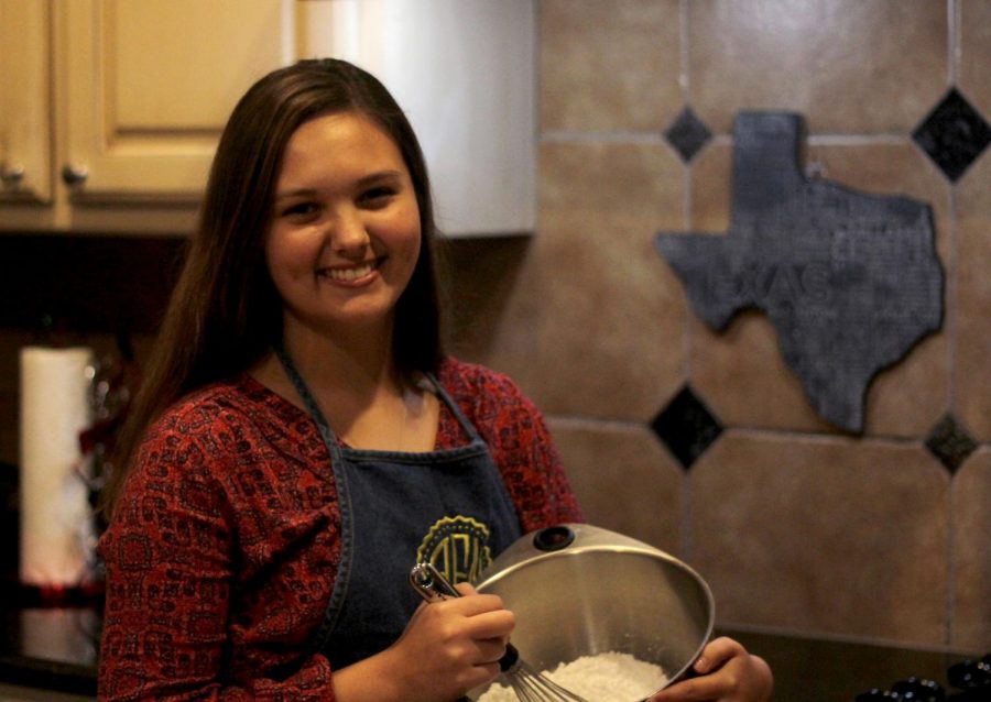 Sophomore+Audri+Fleming+smiles+as+she+bakes+cookies+for+a+customer.+Fleming+has+been+baking+since+eighth+grade+and+plans+to+attend+the+Culinary+Institute+of+America+after+high+school.+%0A