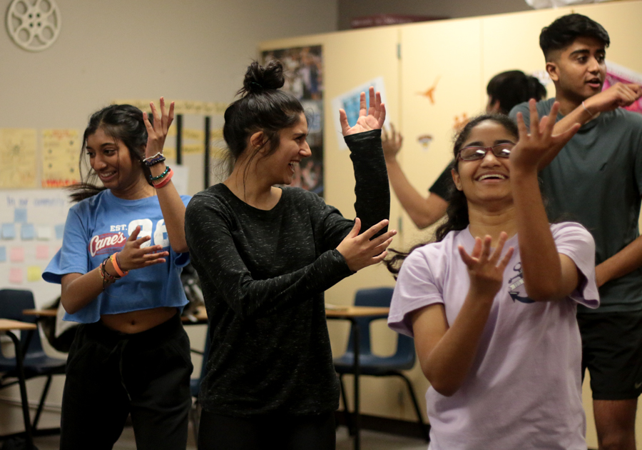 Junior Vaneeza Moloo practices an Indian Bollywood inspired dance afterschool in English teacher Jeanette Rook’s room. The group will perform their dance at the Hawk Multicultural Fest on Feb. 29.