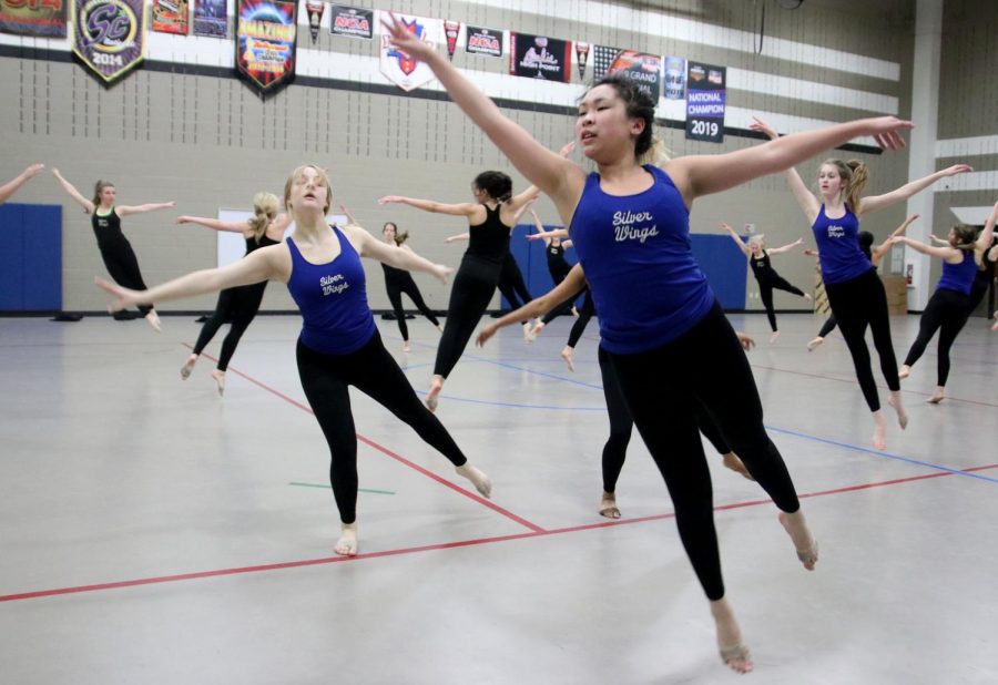 Junior Rachel Pham practices with the other elite team for their group dance. Practices for the competition are held every morning at 7:30 for everyone who is competing.