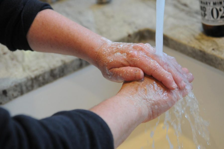The Center for Disease Control says Household members should clean hands often, including immediately after removing gloves and after contact with an ill person, by washing hands with soap and water for 20 seconds.