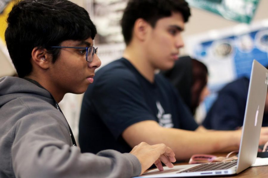 Sophomore Seth Padakandla looks over his debate topics. Debate practices during fourth period and every Tuesday after school.
