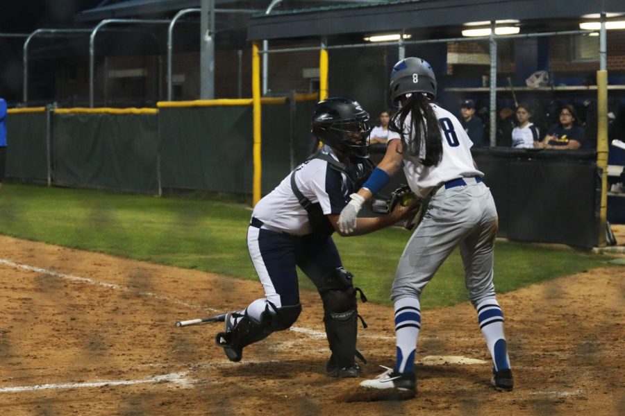 Freshman Shorey Nguyen gets tagged out at home. Senior Zebedee Gonzales and junior Rylee Nicholson rounded the bases after her, both scoring a run. 