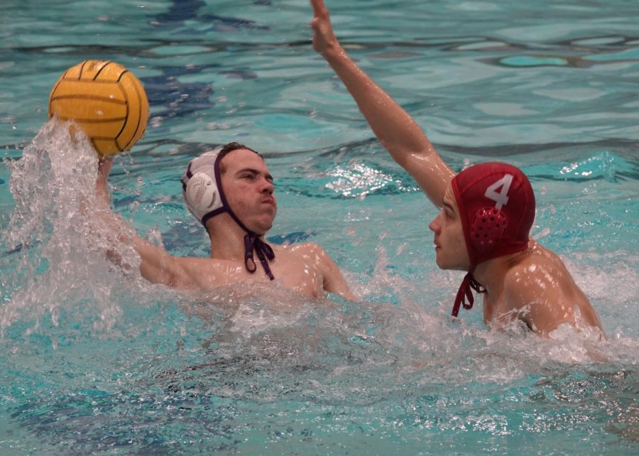 The Hebron/Lewisville boys JV team tries to block a pass by the opposing team. This is the Hebron Swim and Dive team’s second year to sponsor water polo. “We always played water polo as a game during the swim off-season,” senior Quinten Frank said. “We would play water polo, ultimate frisbee and anything just to have fun. The team really liked to play water polo so we adopted it. The team is mainly just swimmers, but there were a couple people who came who were not swimmers.”