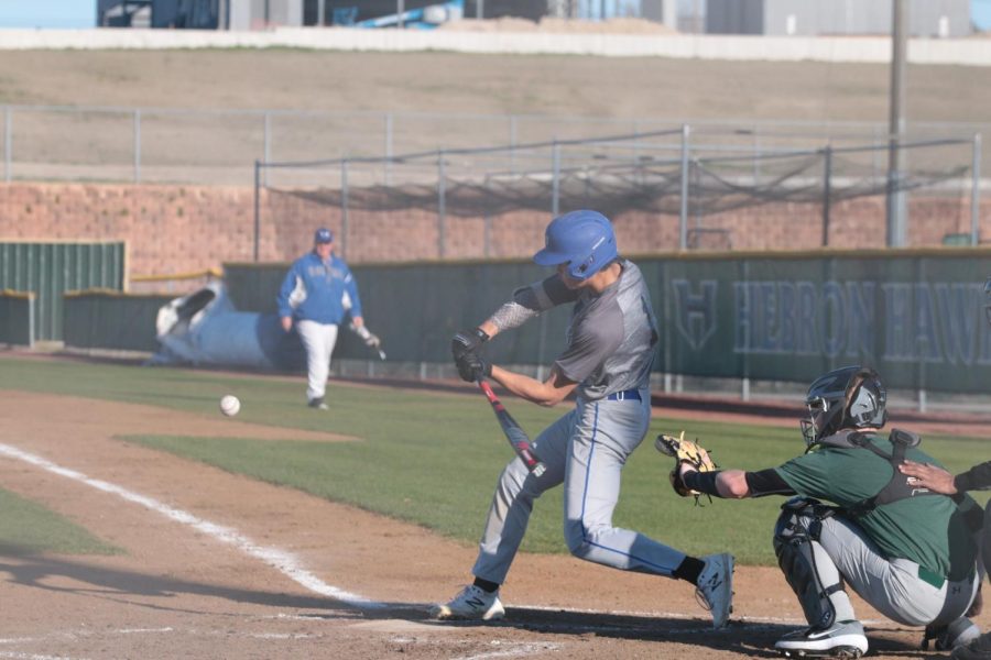 Junior Connor McGinnis hits a ball during a game. The baseball season was halted before districts. 