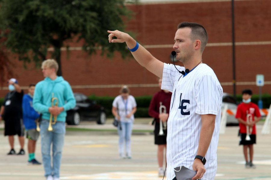 Assistant band director Zack Anderson gives directions to the concert band as they practice marching outside. Anderson is the primary director for Concert I and II and was hired prior to assistant director JP Wilson’s departure. “No one’s got this all figured out, and we’re continuing to figure all of it out as we go,” Anderson said. “I think the one thing that remains the same in all of this, is that were all doing it together.”
