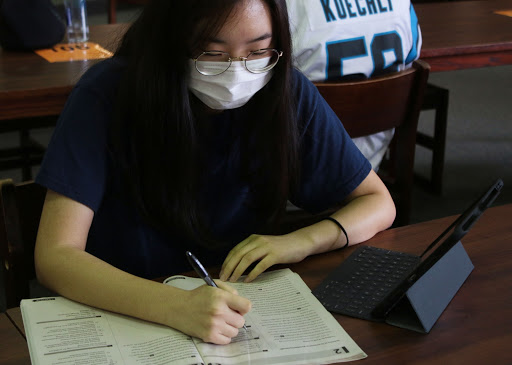 Junior Erica Choi studies in the library for her upcoming SATs. Hebron will have a free, in-person SAT for seniors on Oct. 27 because seniors have limited testing availability due to COVID-19. 
