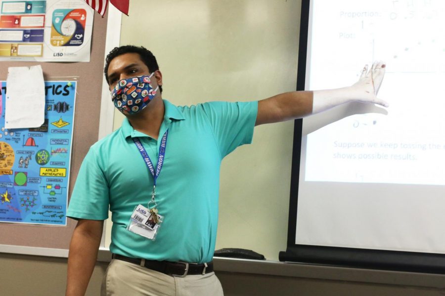 Garza lectures the class about probability by talking about flipping coins. He said he is happy to be teaching in person again. “Not seeing the students was really odd,” Garza said. “It almost felt like I was recording a lesson for people to watch another time.”
