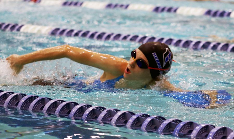 Freshman Avery Gallucci uses a kickboard during morning practices with the team. With the upcoming tri-meet, the swim team has had practice every morning from 6-8:40 a.m. “We’ve got to train all week, we’ve got to train through our meets, and then when it’s time to go fast, we rest down,” swim coach Donzie Lilly said. “So our swimmers work all six months to go fast at one meet.”