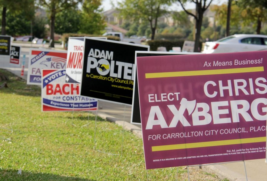 Hundreds of signs surround the Carrollton Public Library, which is an early voting location. The signs are placed to promote those who are running for positions such as mayor and senator.  