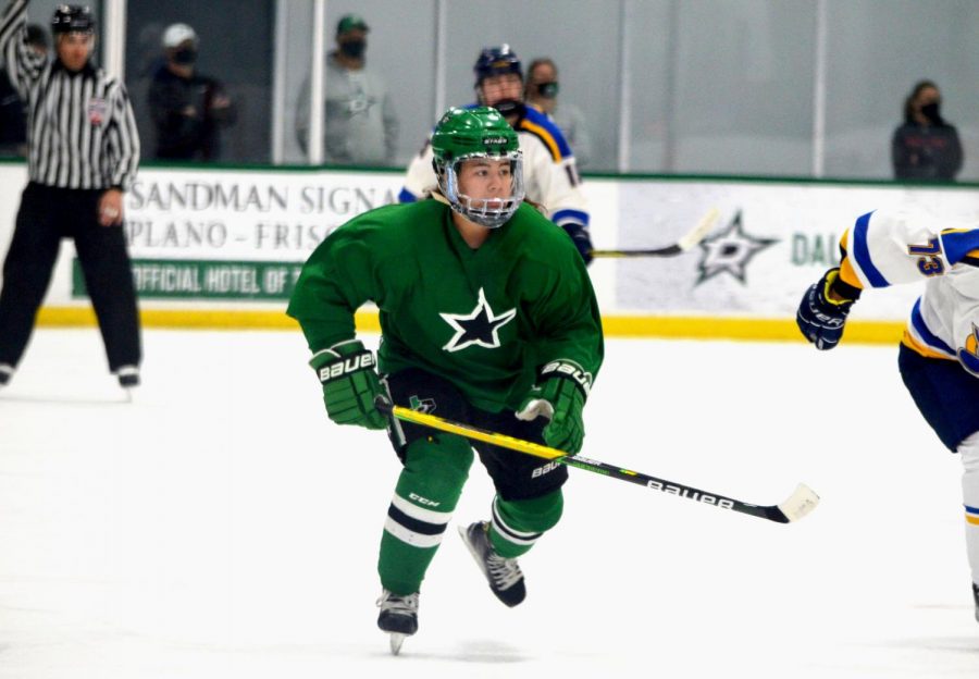 Senior Bronwyn Khangsar skates across the ice during a hockey game. She is one of the team captains and plays defense for the Dallas Stars Elite Girls hockey team. “[It’s difficult] constantly being motivated to improve,” Khangsar said. “There’s so many ways to get better and be the best that you can be.”