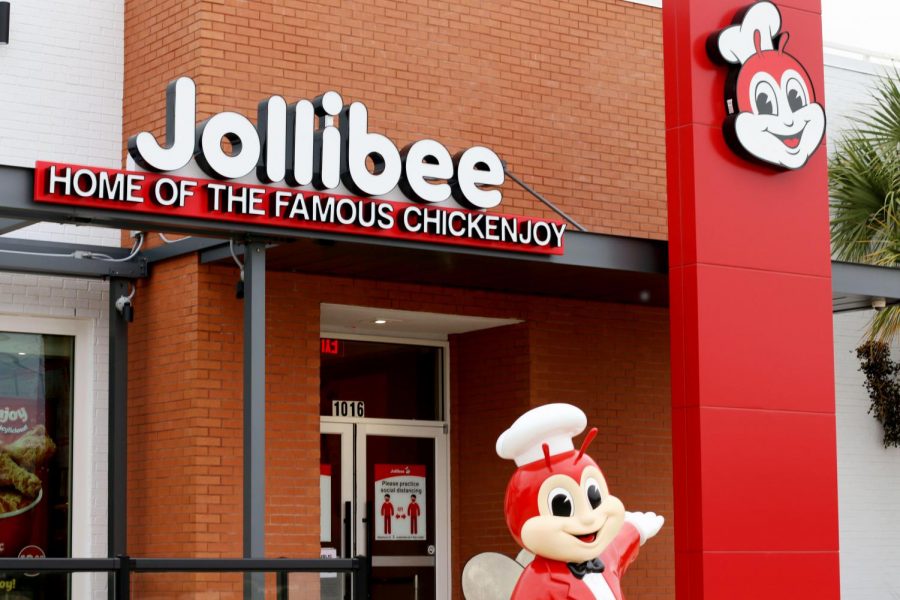 Jollibees+mascot%2C+named+Jollibee%2C+stands+outside+the+restaurant+to+greet+guests.+Jollibee+opened+in+Plano+in+August.++