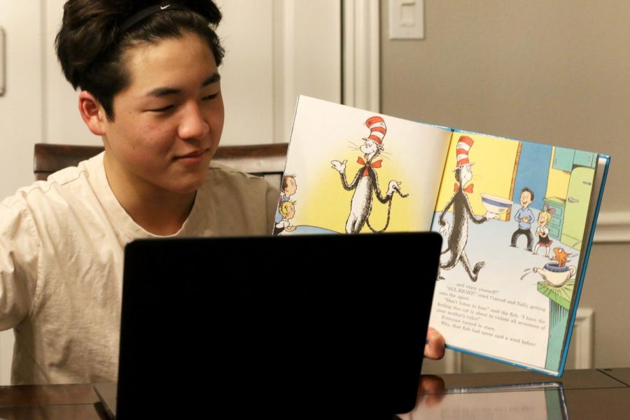 A student is reading to younger children over a virtual call. Since volunteering opportunities are limited due to COVID-19, students are finding creative ways to help their community through programs like Reading Partners and Vogel Alcove, both of which validate service hours.