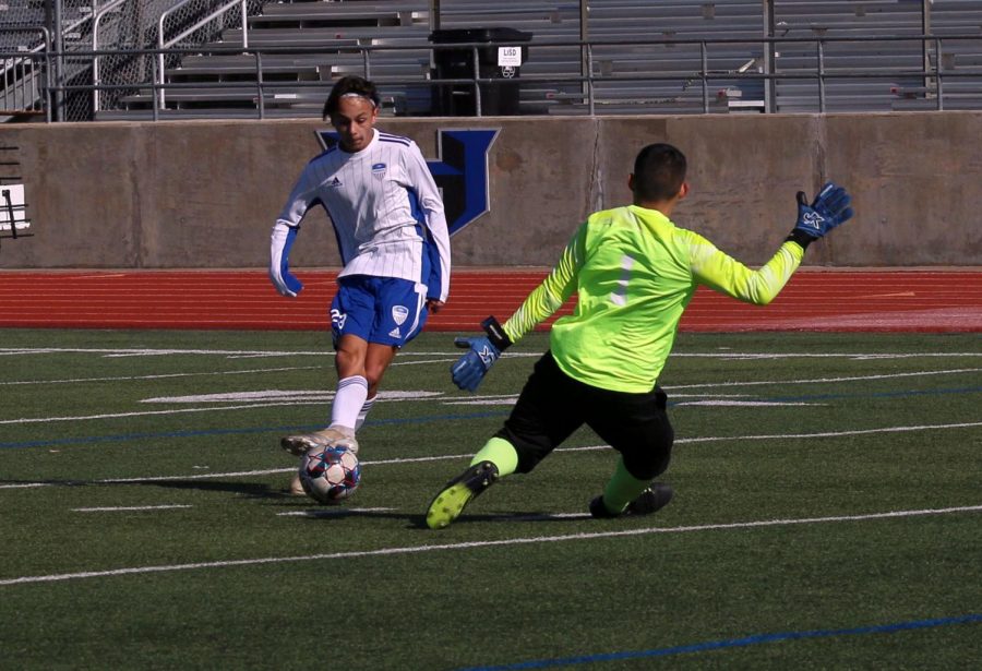 Sophomore Jett Thomson attempts to score on the Lions. Thomson often plays an attacking role, either as a midfielder or forward.  