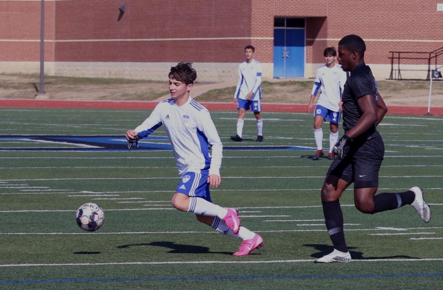 Sophomore midfielder Luke Dean races to the ball. Dean scored a goal off a volley during the game, aiding in the team’s win. This was his second goal of the season.  