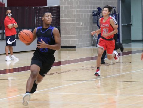 Senior David Deal scans the court looking for the open player. Deal is currently the teams leading scorer on the season.
