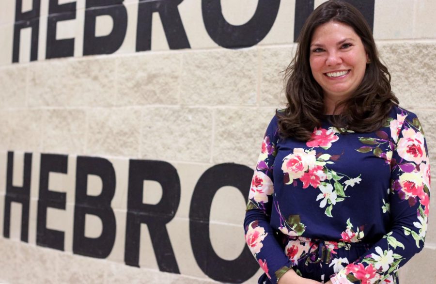 Assistant principal Rachel Flanders poses by the school’s front office entrance. 