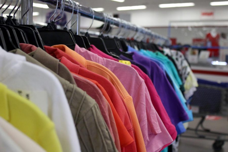 Clothes hang on a rack at a Salvation Army store. The Salvation Army collects clothing, furniture, household appliances and other items that can be resold. 