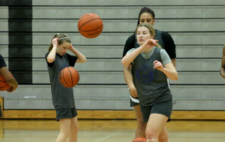 Senior Zosia Rej passes the ball to her teammate during practice Feb. 2. The team finished fourth in their district. 