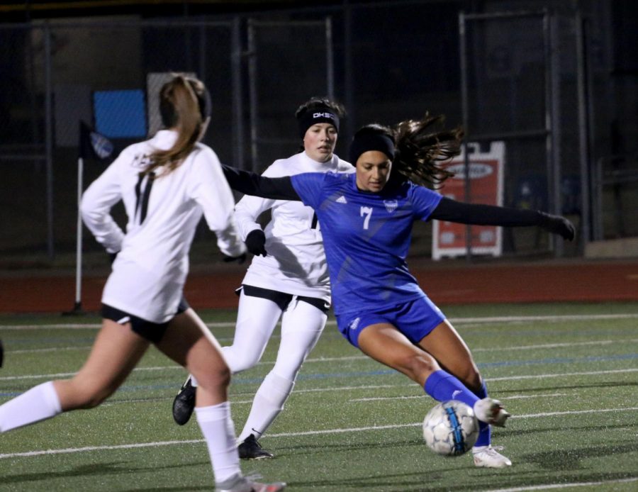 Senior forward Matilda Torres traps the ball to keep it away from the opponent. Torres has scored a total of two goals this season.
