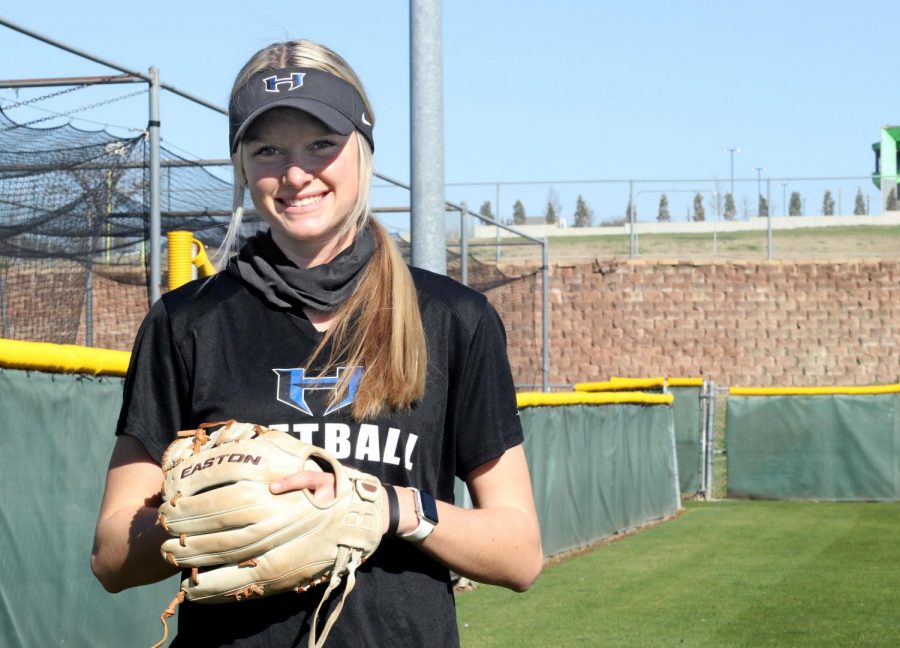 Senior+Riley+Nicholson+poses+outside+the+softball+field+with+her+glove.+Nicholson+has+been+playing+softball+for+the+last+8+years+and+has+committed+to+play+in+college+too.