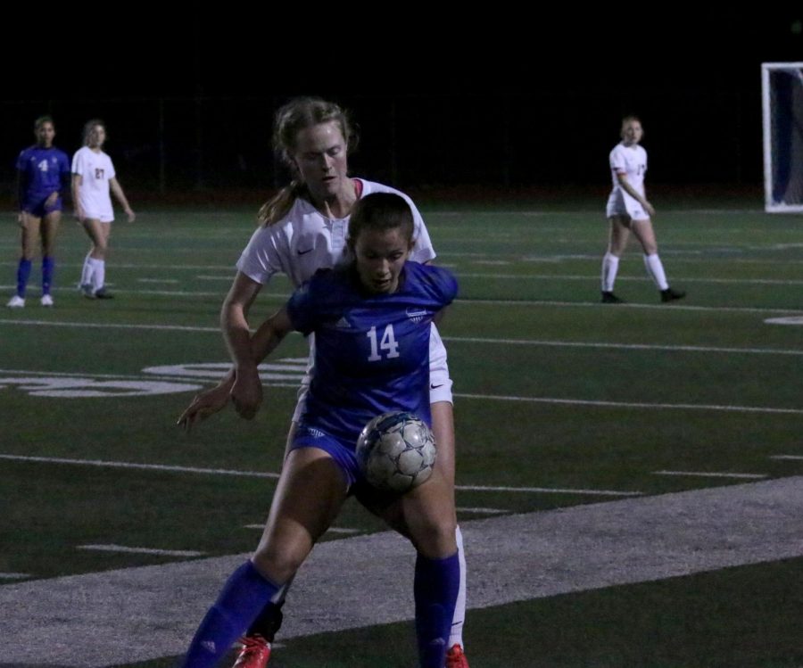 Junior Sydney Japic shields the ball from the defender. This is Japic’s first year on the team after moving from California earlier this year.
