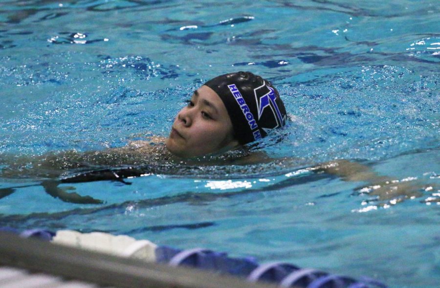 Freshman+Phoebe+Truong+practices+her+strokes+during+morning+practice.+The+team+practices+everyday+at+the+LISD+Eastside+Aquatic+Center+from+6%3A15+a.m.+to+8%3A45+a.m.