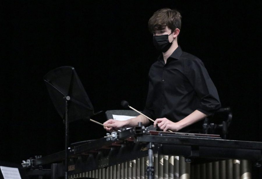 Senior Tyler Kerch performs with an ensemble at the percussion concert on March 9. Percussionists are required to play a variety of instruments, including marimbas, snares, chimes, timpanis and more.