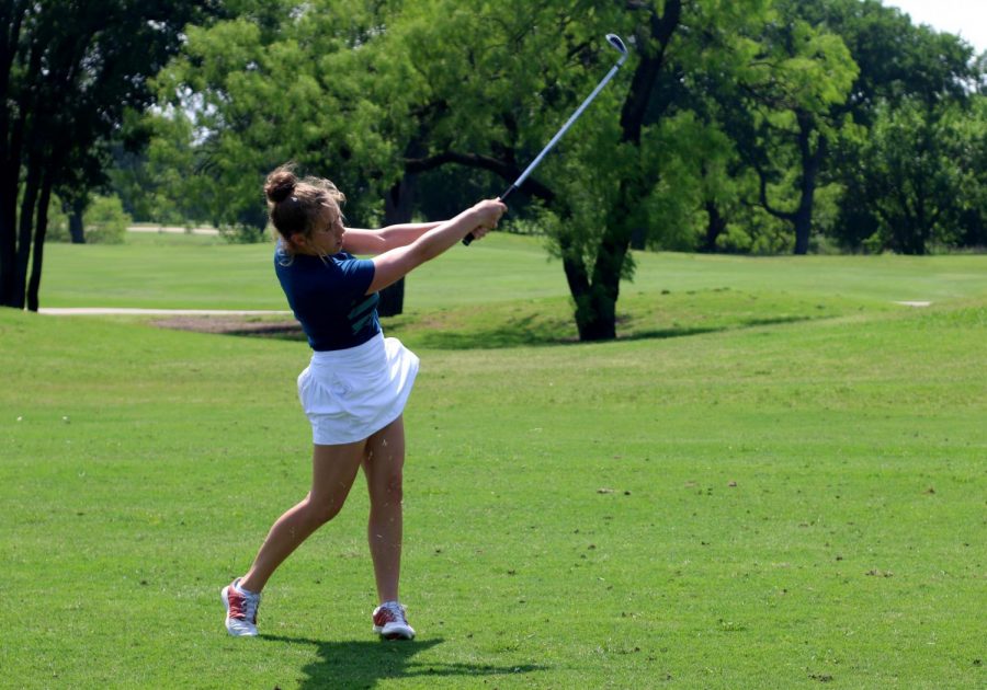 +Senior+Gracie+Tribolet+follows+through+after+hitting+the+golf+ball+at+a+practice+prior+to+the+state+tournament.+This+year+was+Tribolet%E2%80%99s+fourth+year+on+the+golf+team