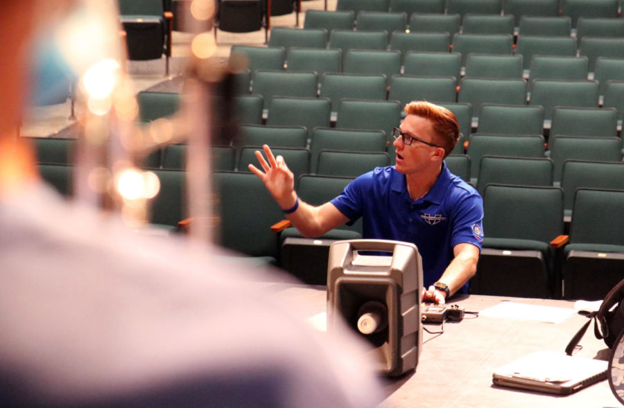 Assistant band director Brock Alsaffar instructs the trumpets and mellophones during class on Aug. 31. Alsaffar works with all high brass players across the program, regardless of which class period they’re placed in. 