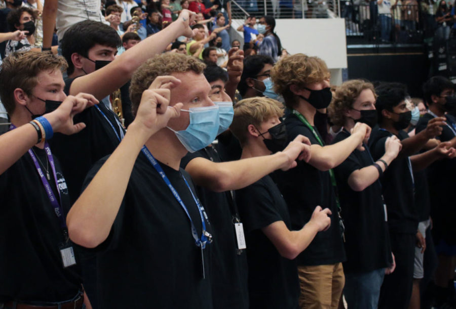 The HawkAppella choir closes out the pep rally by leading the crowd in the school song. “This was my first time performing in a pep rally,” junior Christopher Clausen said. “It was very exciting to go down to the court and sing a song for most of the school. At first I was a bit nervous, but since I was singing with my friend it was fun and enjoyable. I got a chance to sing in front of my classmates that didn’t go to our concerts and was happy that they got to hear us.”
