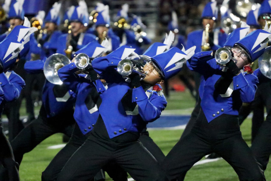 Seniors Alan Nam and Allison Anders play the trumpet during halftime. Seniors were pinned with a red rose boutonniere prior to the game for the band’s senior night.