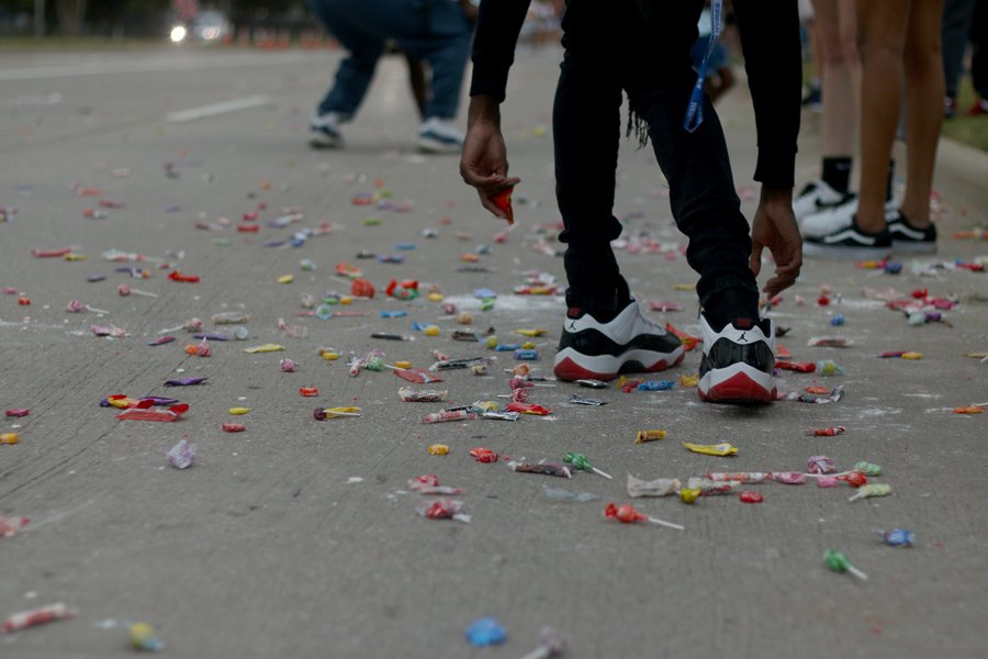 Candy lies on the streets surrounding Hebron as the parade concludes. Following this event, a community pep rally was held in the Hawk Stadium for community members to see what the student pep rallies are like. 