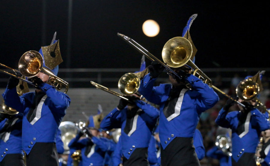 The+trombone+section+moves+across+the+front+of+the+field+as+they+perform+during+halftime+at+the+Homecoming+game+on+Oct.+22.+The+band%E2%80%99s+last+performance+of+the+show+%E2%80%9CPenstriped%E2%80%9D+will+be+during+the+2022+Tournament+of+Roses+Parade.
