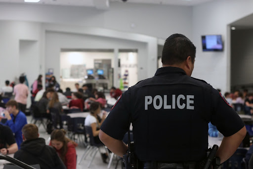 School resource officer David Lee moniters the cafeteria during lunch.