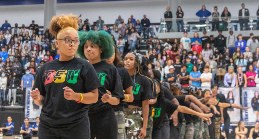 The step dance team performs during a school pep rally.